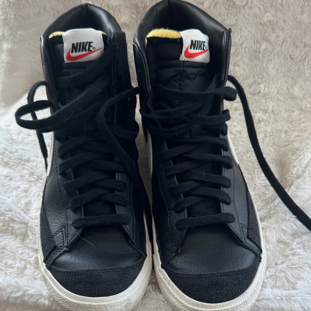 Nike Black High-Top Sneakers with White Swoosh and Yellow Tongue Detail